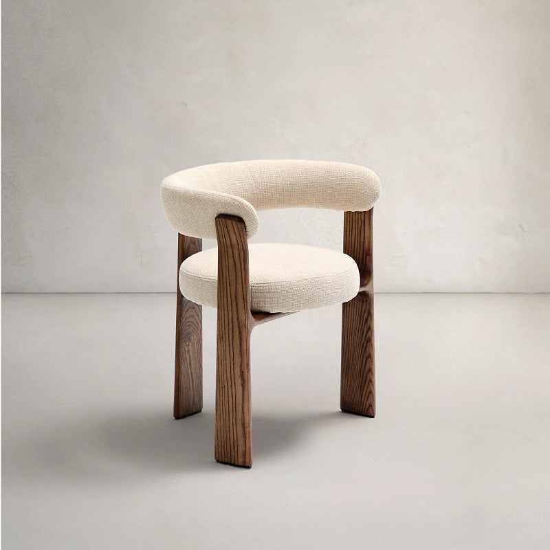 Ivory cream upholstered sculptural dining chair with architectural wooden legs