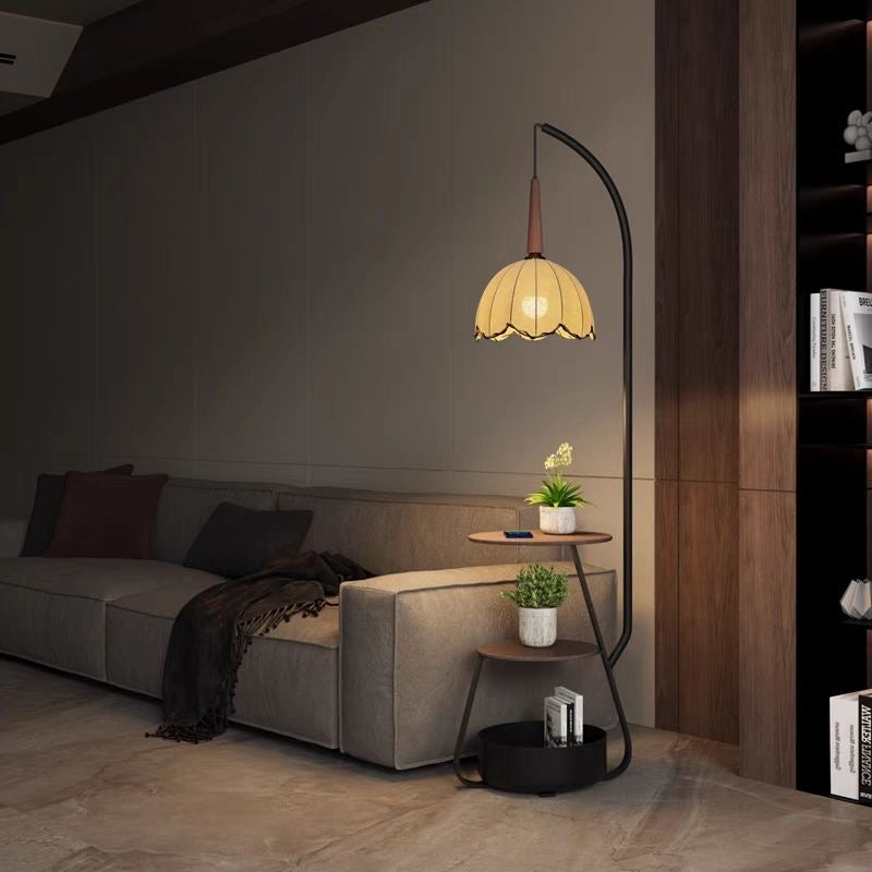 vintage scalloped floor lamp with side table beside modern sofa