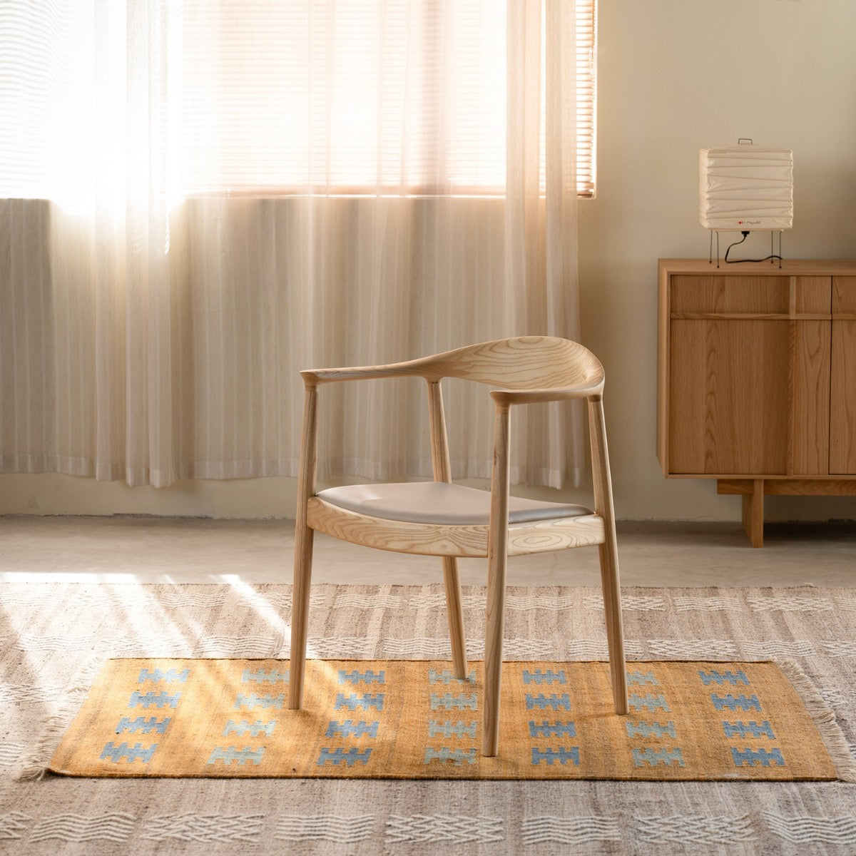 Soren Solid Ash Wood Dining Armchair – Sculptural Curved Back Chair