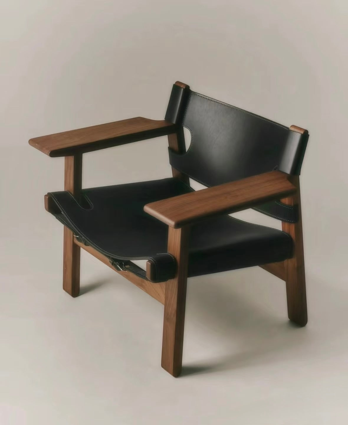 Modern Spanish Chair version in dark walnut finish with black leather upholstery.